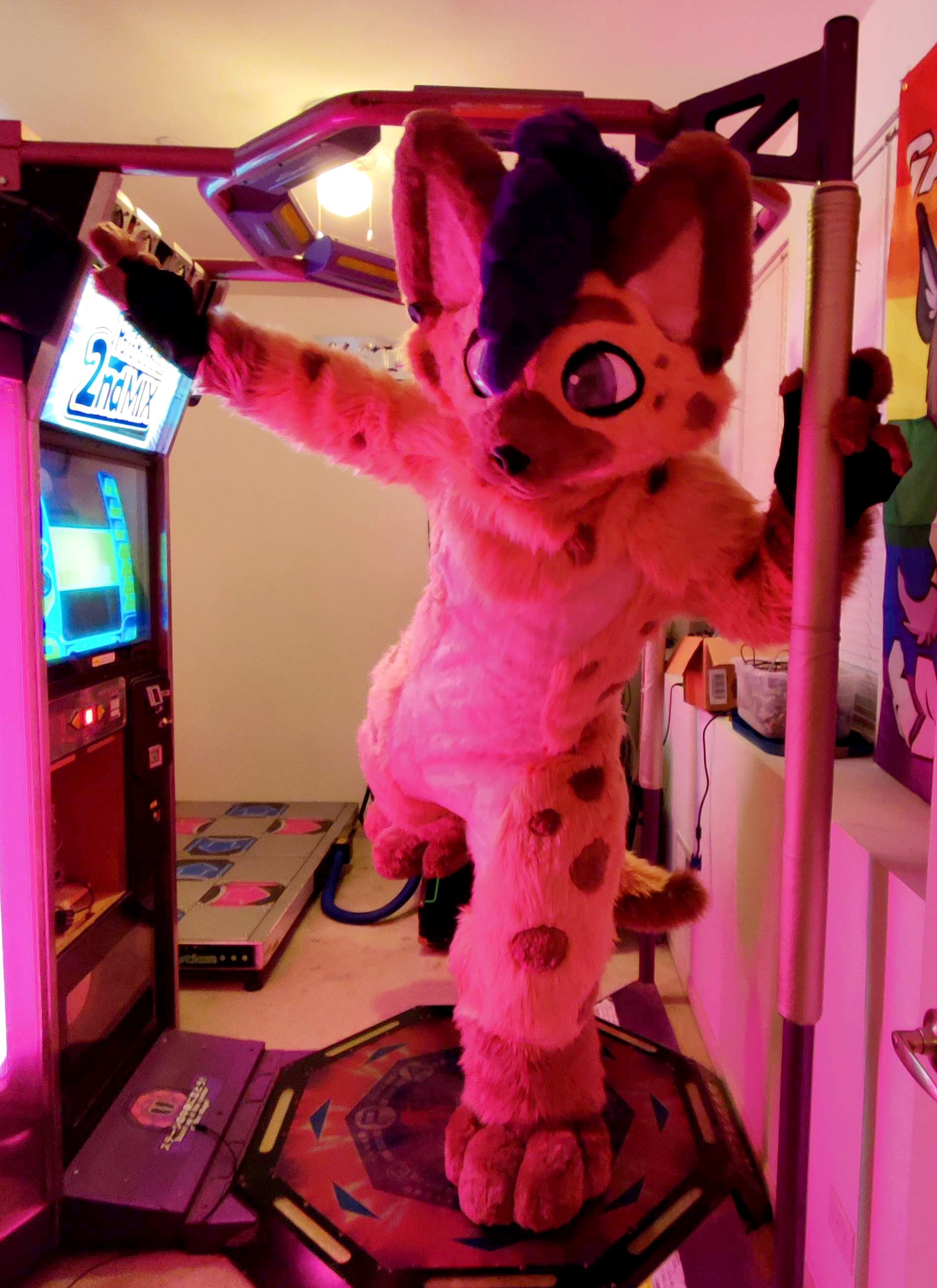 Me messing around on a Para Para Paradise</a> machine I restored in a suit by Rising Sun Kemono